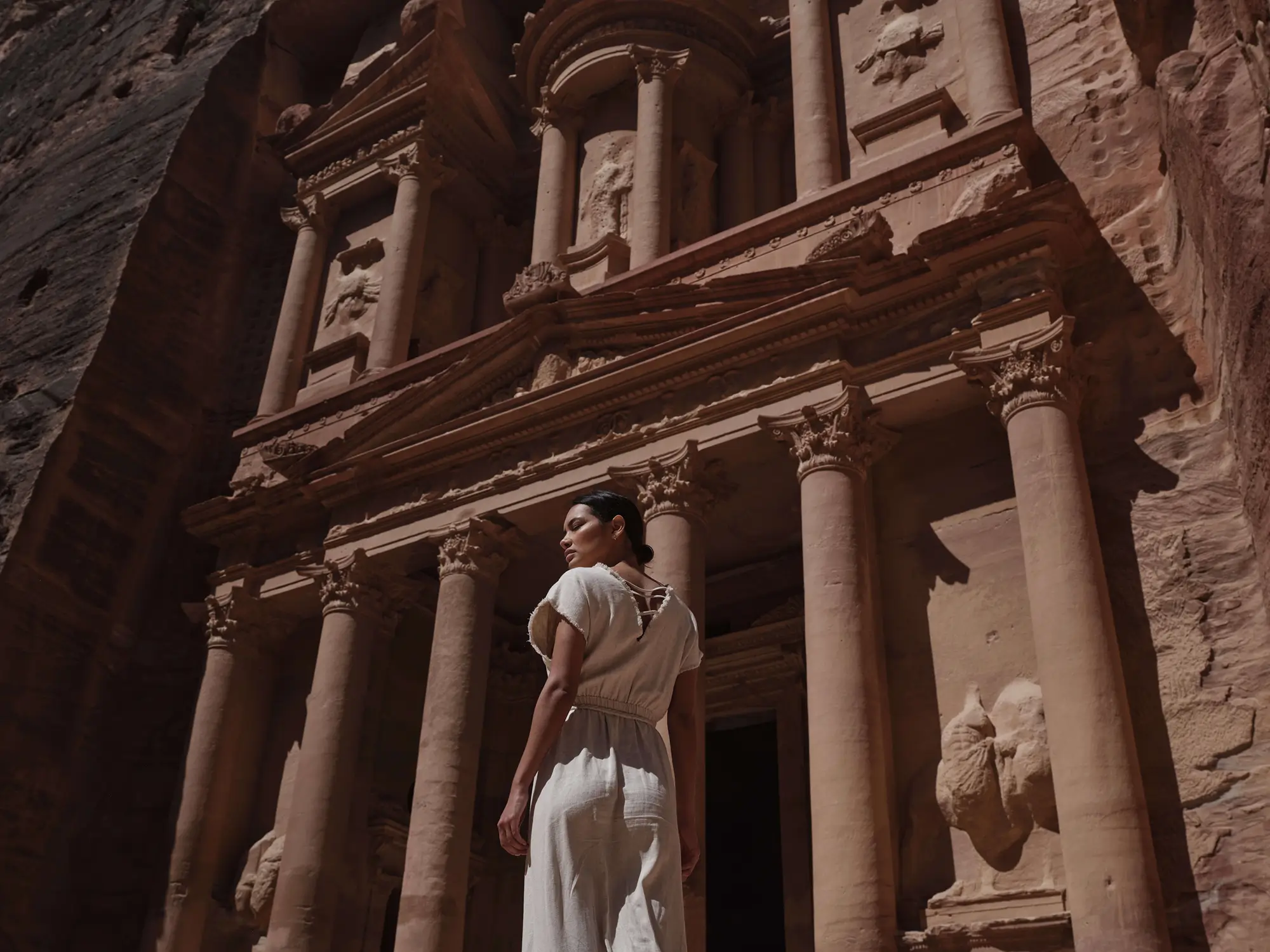 Young woman posing infront of Aqaba's historical sites